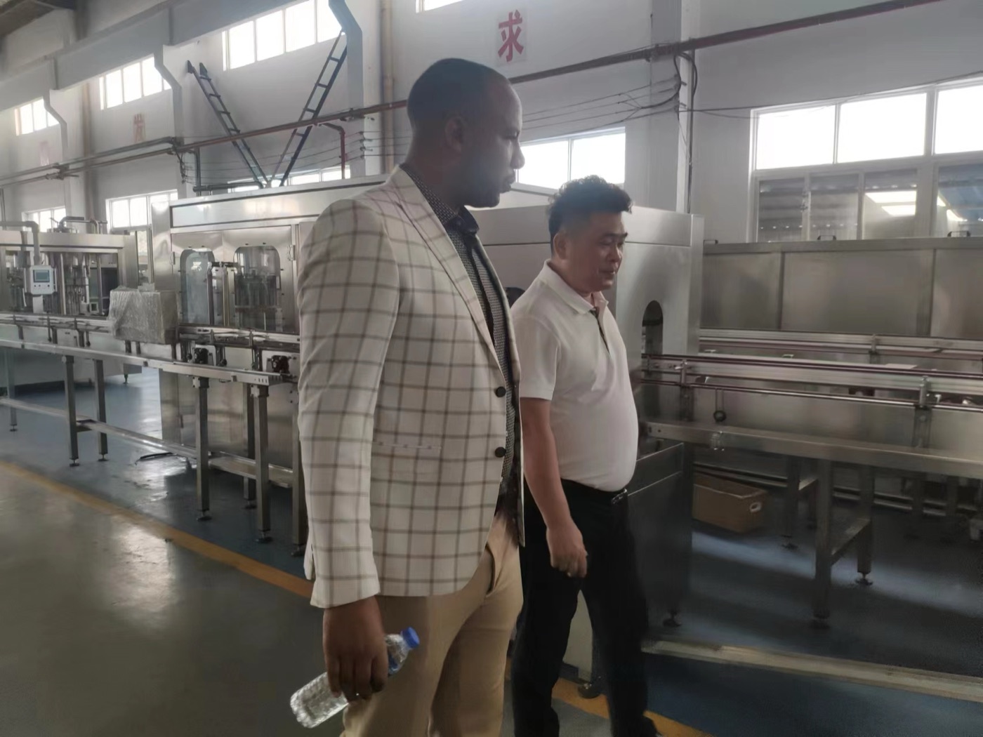 Factory Inspection Overseas customer inspecting Sokos beverage filling machinery in factory